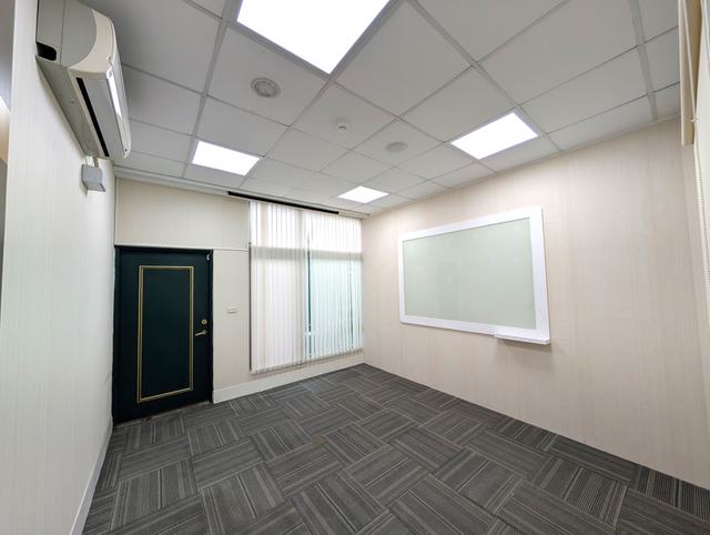 Small partitioned room with a whiteboard and terrace access, suitable for a small meeting room or executive office, Alliance Park, Zone B, Floor 2